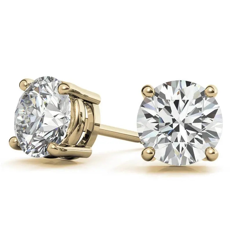 0.50 CTW lab grown diamond stud earrings with round brilliant cut stones set in 14K yellow gold four-prong settings