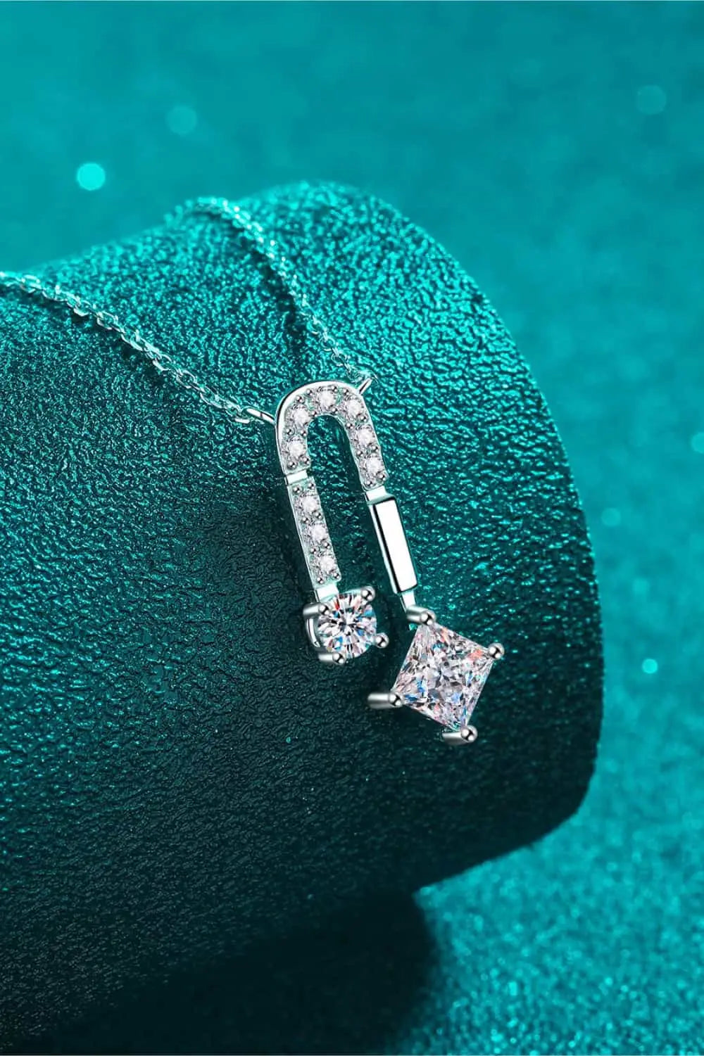 1.3 Carat Moissanite sterling silver necklace with rhodium plating featuring sparkling round and princess-cut stones on a delicate chain