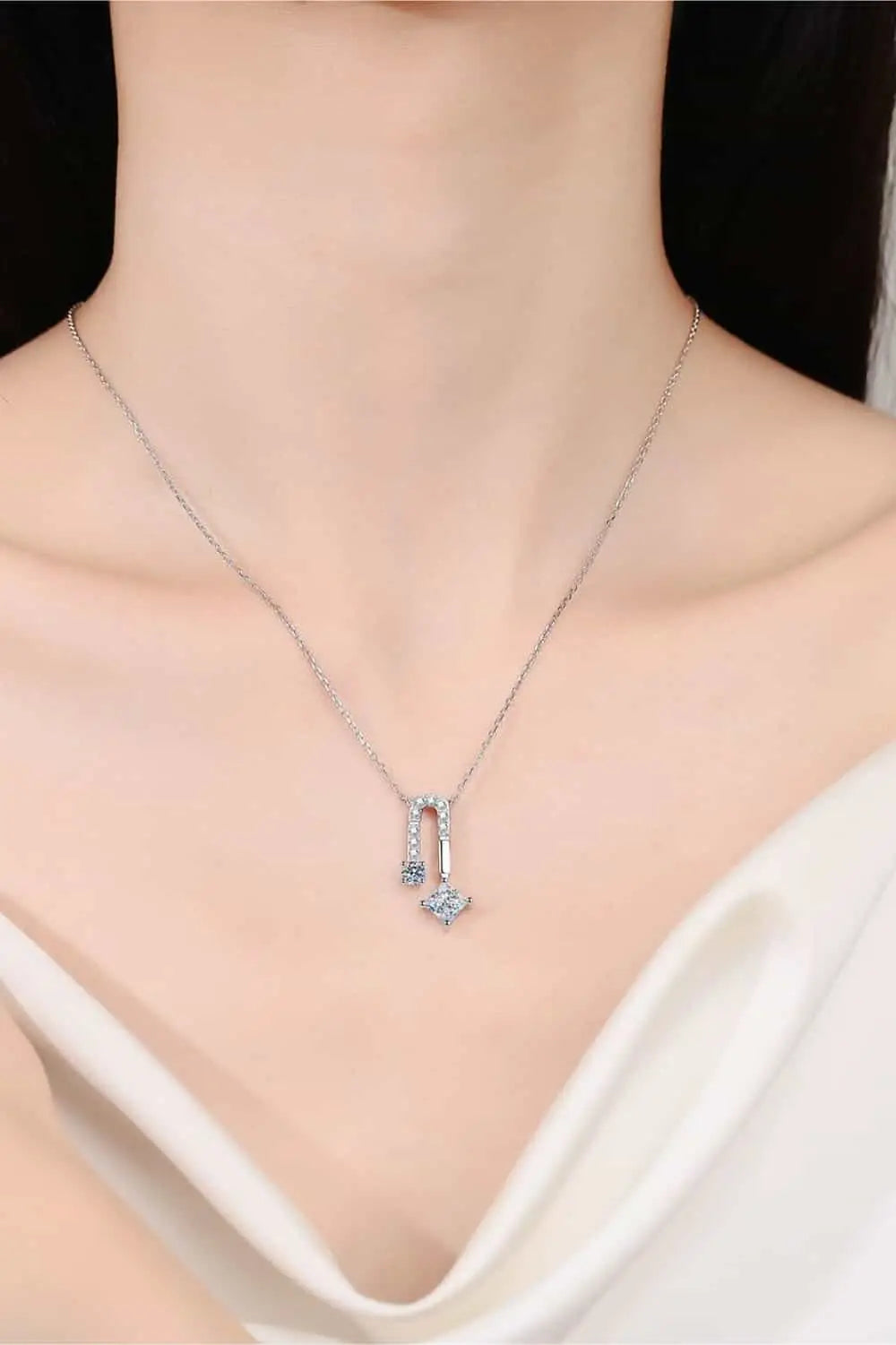 1.3 Carat Moissanite pendant necklace in sterling silver with rhodium plating and zircon accent stones, delicate chain