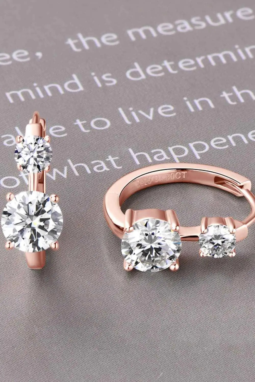 1.3 Carat Moissanite earrings in 925 sterling silver with 18K rose gold plating featuring clear round-cut stones