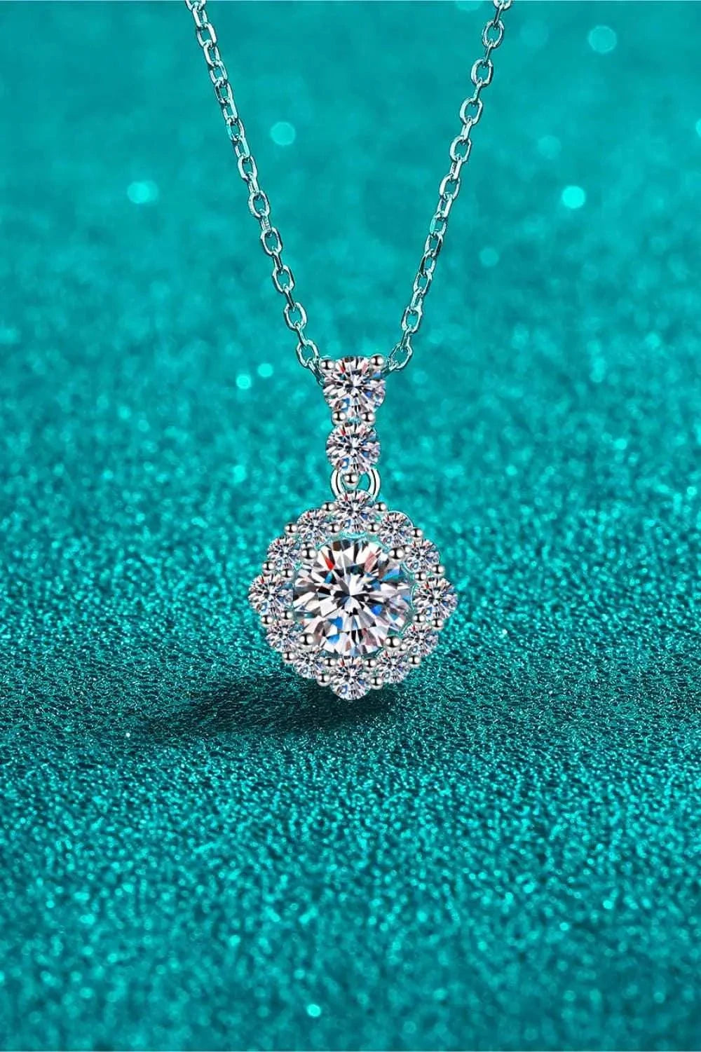 Carat Moissanite necklace in 925 sterling silver with a round center stone and zircon accent stones on a delicate chain
