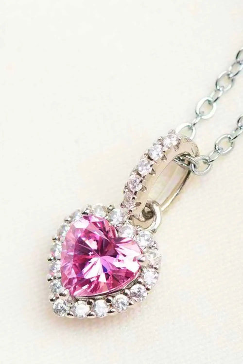 1 Carat Moissanite heart pendant necklace with a pink moissanite center stone surrounded by clear zircon stones on a silver chain