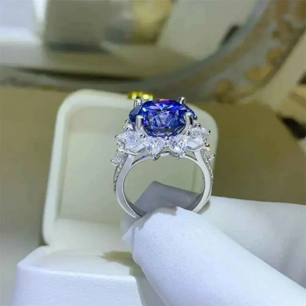 10 Carat Moissanite ring featuring a large blue oval center stone set in 925 sterling silver with clear side stones