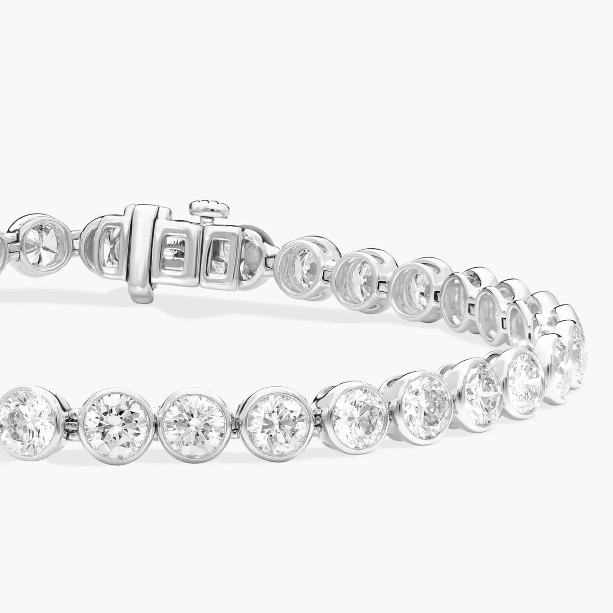10 CTW moissanite bracelet in 14K white gold plate with bezel set round-cut stones and box clasp with safety latch