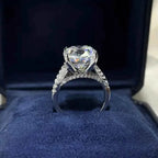 925 sterling silver ring with a large round clear stone and smaller accent stones, elegant Moissanite jewelry design