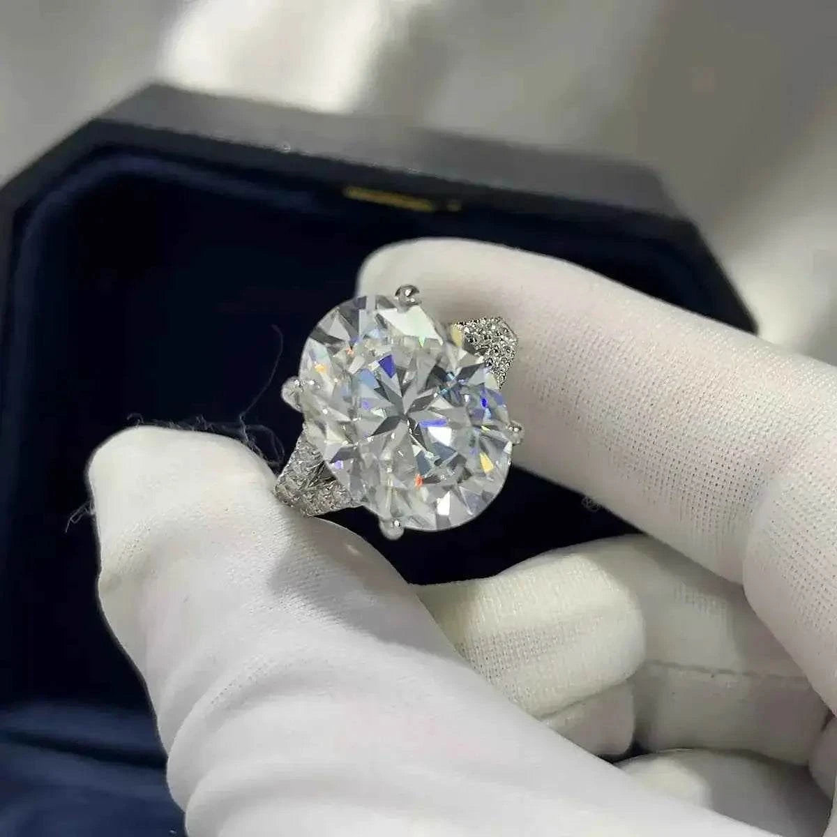 925 sterling silver ring with a large round clear stone centerpiece and smaller side stones, Moissanite jewelry