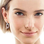2.16 Carat Moissanite sterling silver earrings with 18K gold plating, featuring an oval linked design encrusted with small sparkling stones