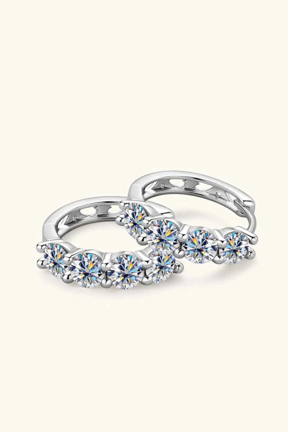 2.4 Carat Moissanite sterling silver huggie earrings with platinum plating and multiple round brilliant stones in a minimalist design