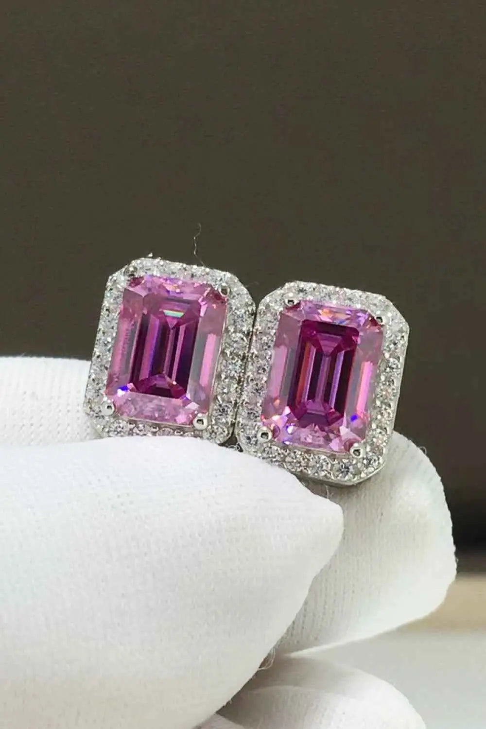 2 Carat Moissanite stud earrings with rectangular pink gemstones surrounded by small clear stones set in silver metal