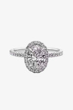 2 Carat Moissanite platinum-plated ring with oval center stone, surrounded by smaller stones on polished silver band