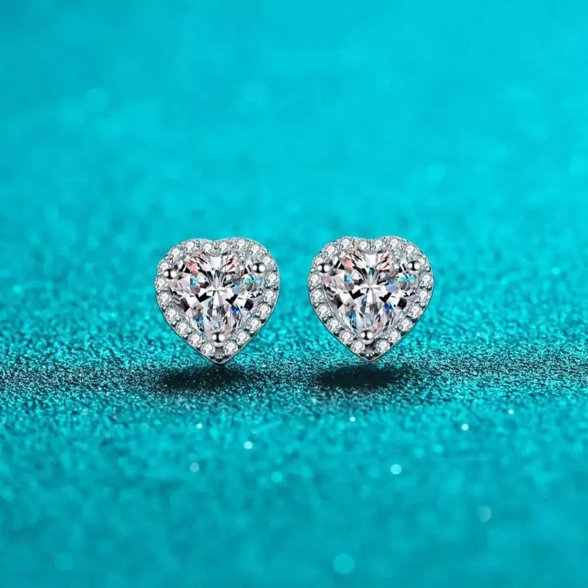 2 Carat sterling silver heart-shaped earrings with clear moissanite stones and intricate halo detailing