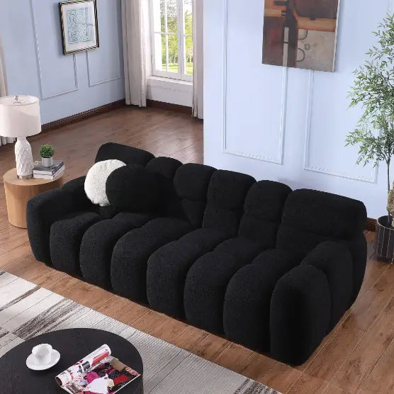 Elegant black boucle sofa for timeless designer living spaces