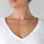 3.00 CTW lab grown diamond round brilliant bezel pendant in 14K yellow gold on delicate chain worn on neck
