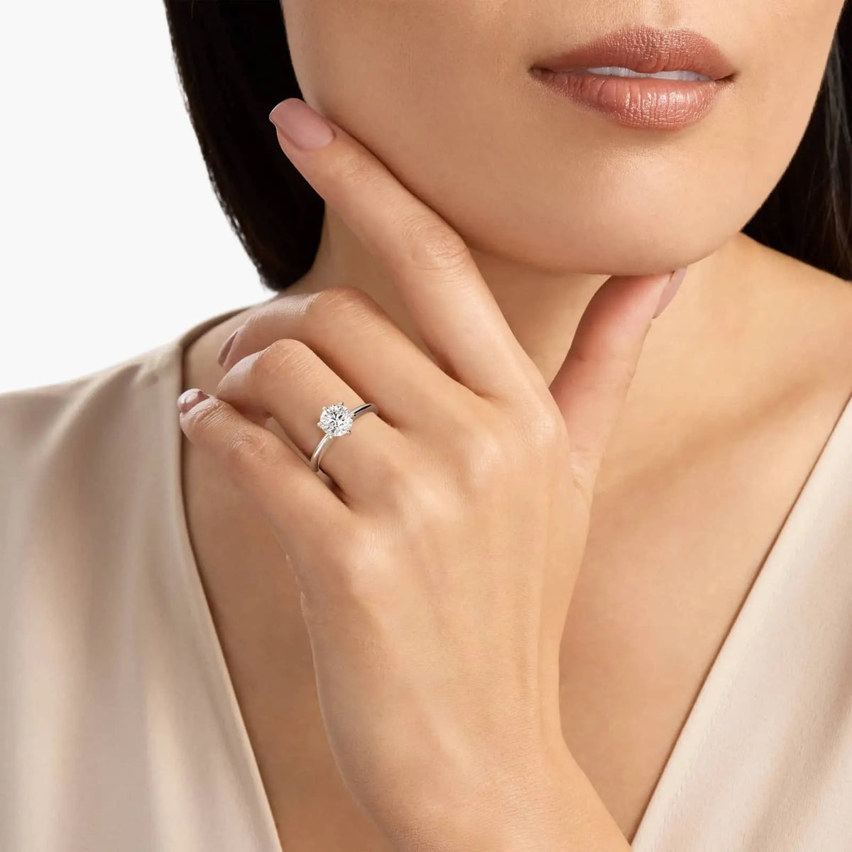 3.00 CTW round lab grown diamond solitaire engagement ring in 14K white gold with six-prong setting on hand