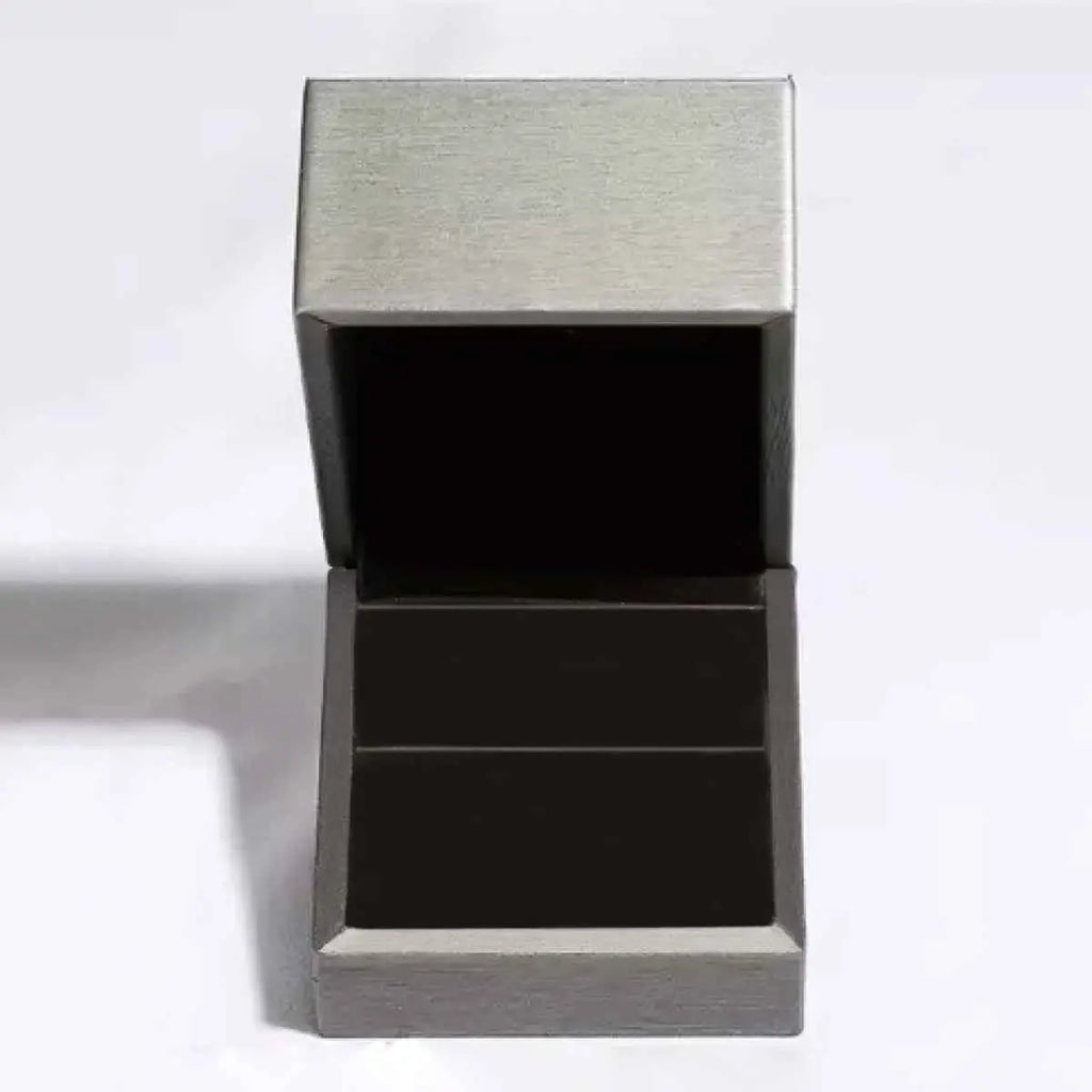 3 Carat Moissanite ring in a silver-tone metallic box with black velvet interior, showcasing elegant presentation