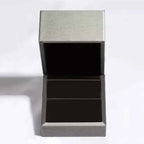 3 Carat Moissanite ring in a silver-tone metallic box with black velvet interior, showcasing elegant presentation