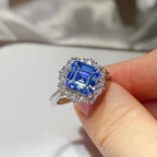 3 Carat Moissanite silver ring featuring a large square-cut blue gemstone surrounded by small clear stones in a platinum-plated setting