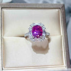 925 sterling silver ring with a vibrant pink central stone surrounded by clear smaller stones, 3 Carat Moissanite centerpiece