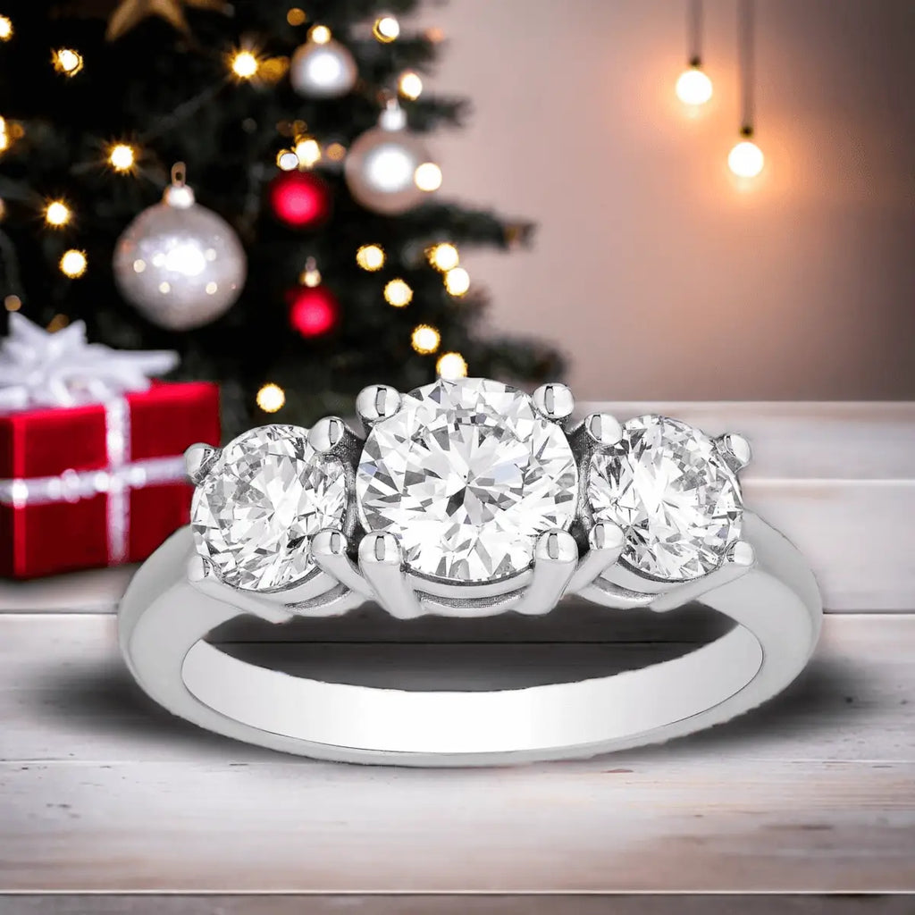 3 CTW AGI Certified three stone engagement ring with round-cut diamonds set in polished white gold band