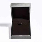 empty grey and black jewelry box with hinged lid, perfect for presenting 5 Carat pendant necklace