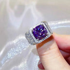 Sterling silver ring with a large square purple gemstone and small clear stones surrounding the center, showcasing 5 Carat Moissanite design.