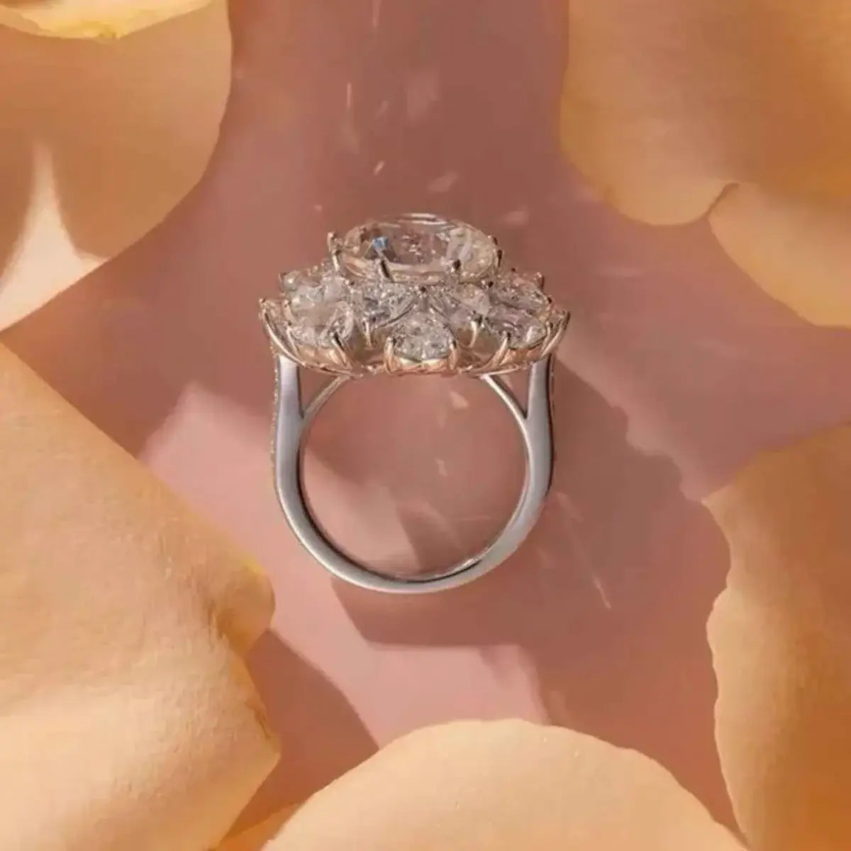 5 Carat sterling silver ring with a large central clear gemstone surrounded by smaller stones in a floral cluster design