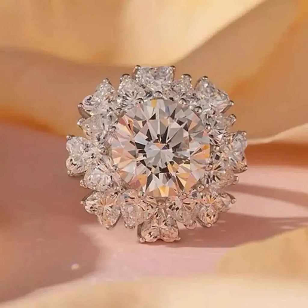 5 Carat round clear Moissanite ring with 925 sterling silver band and a halo of smaller stones surrounding the center stone