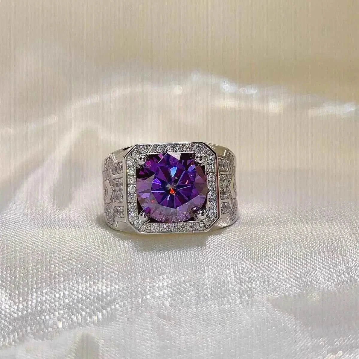 Sterling silver ring featuring a large round purple stone surrounded by smaller clear stones, ornate band design, 5 Carat Moissanite