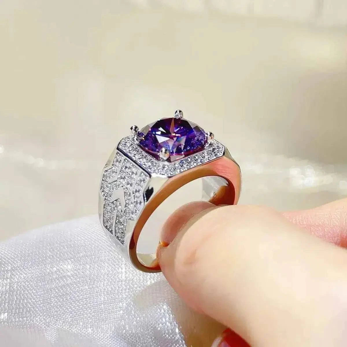 925 sterling silver ring with a large purple 5 Carat Moissanite center stone and small clear stones on the band