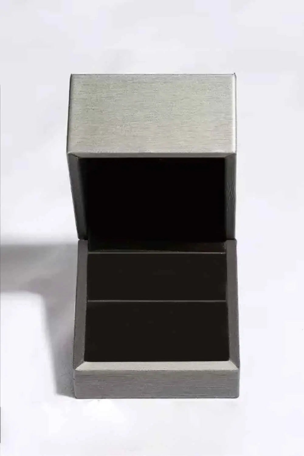 Open silver jewelry box with black interior lining designed to hold a 5 Carat Moissanite ring or other small items