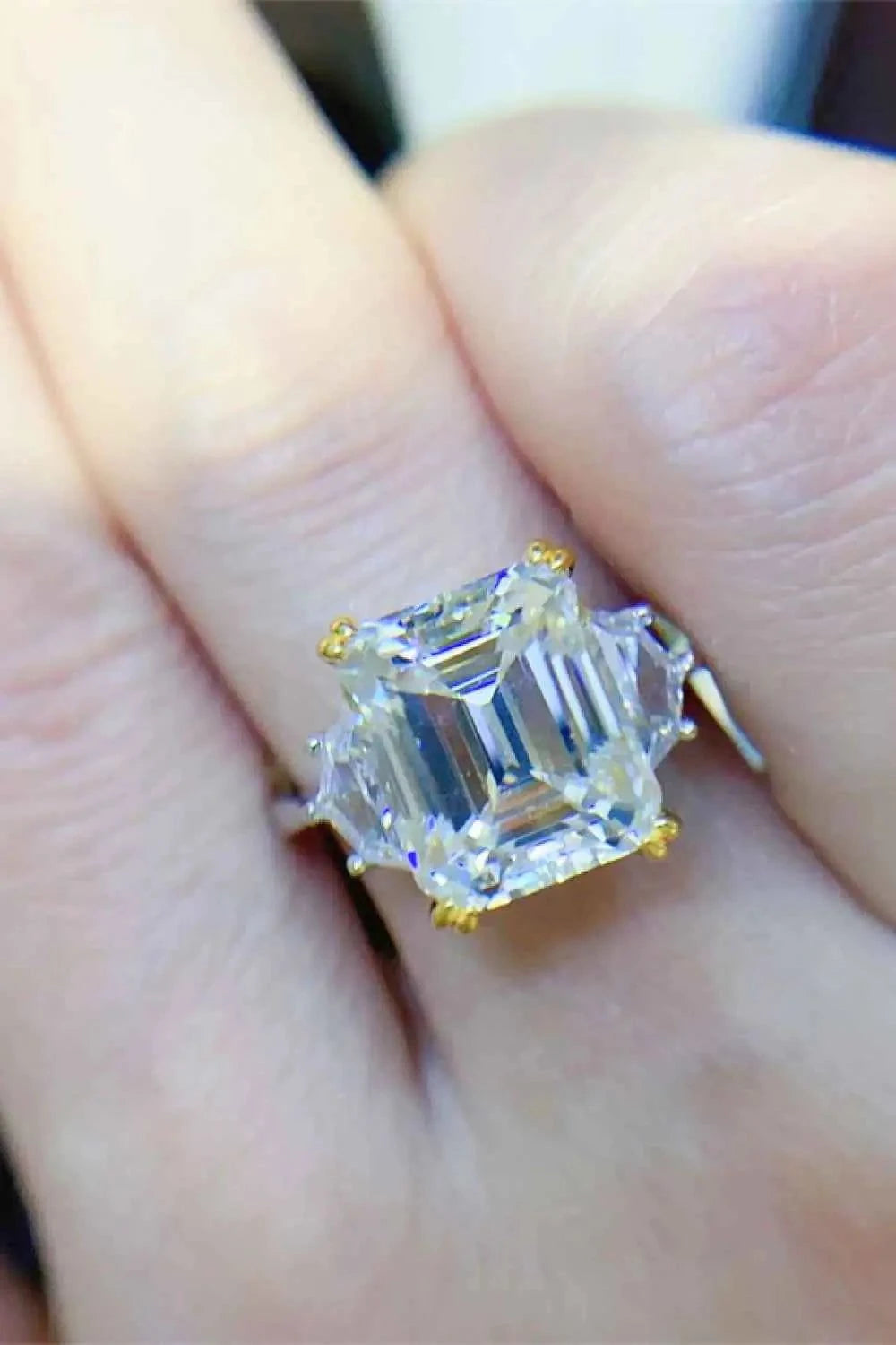 925 sterling silver ring with a large square-cut 5 Carat Moissanite center stone and gold prong settings