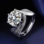 925 sterling silver ring with a large round 5 Carat Moissanite center stone and intricately detailed band studded with smaller stones