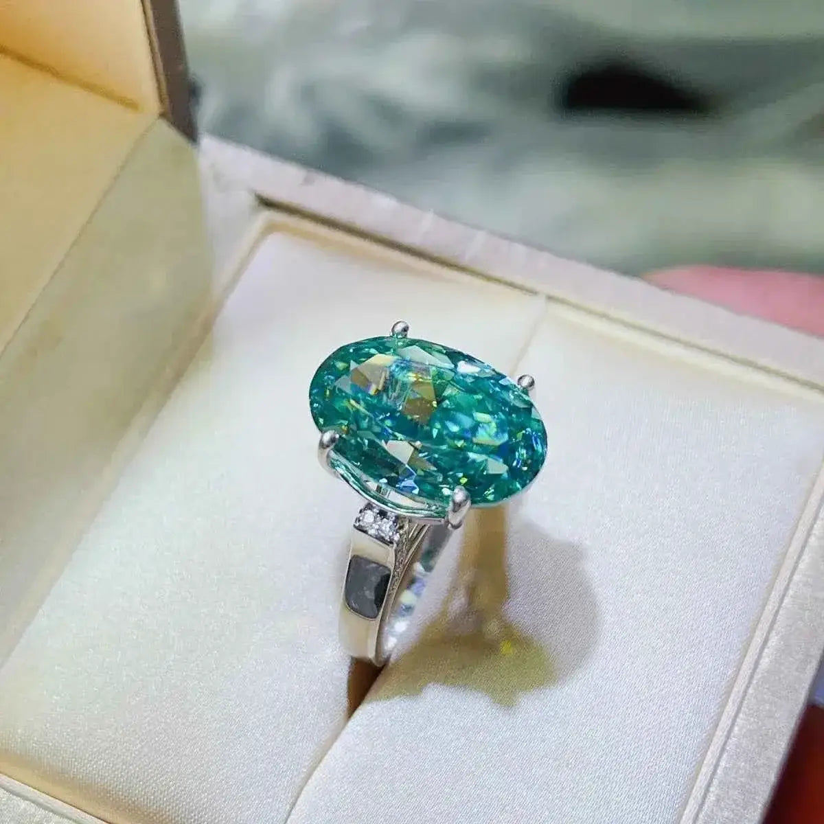 925 sterling silver ring with a large oval blue 5 Carat Moissanite stone set in a platinum-plated band