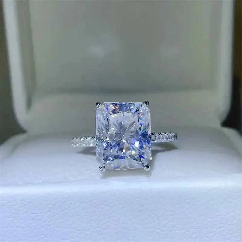 925 sterling silver ring featuring a sparkling rectangular 5 Carat Moissanite center stone with accent zircon stones on the band