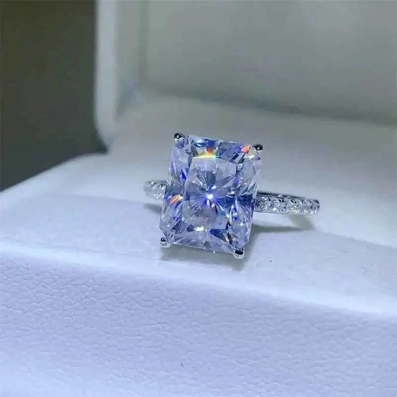 925 sterling silver ring featuring a large rectangular 5 Carat Moissanite center stone with smaller zircon accents on the band
