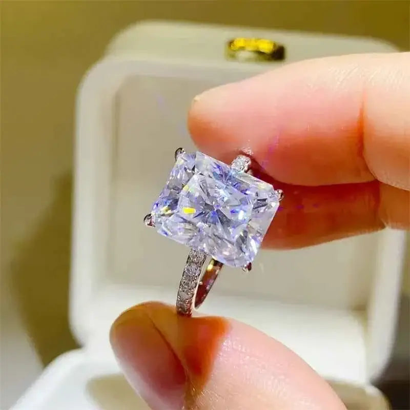 925 sterling silver ring featuring a large square-cut 5 Carat Moissanite center stone with smaller zircon accent stones on the band