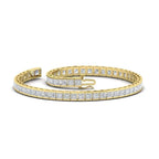 Created Moissanite yellow gold over sterling silver tennis bracelet with princess cut stones in half bezel setting