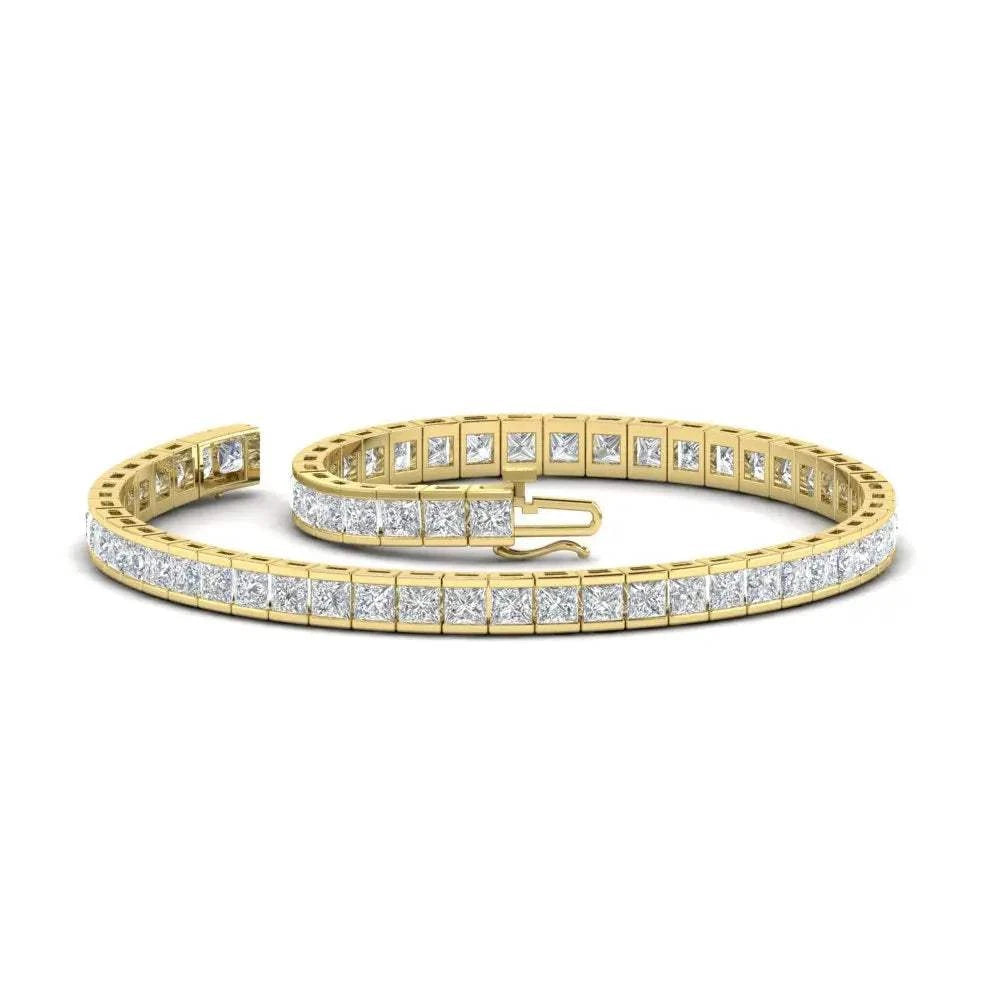 Created Moissanite yellow gold over sterling silver tennis bracelet with princess cut stones in half bezel setting