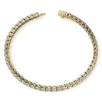 6ctw Created Sapphire tennis bracelet with 3mm round stones set in yellow gold overlay with secure clasp