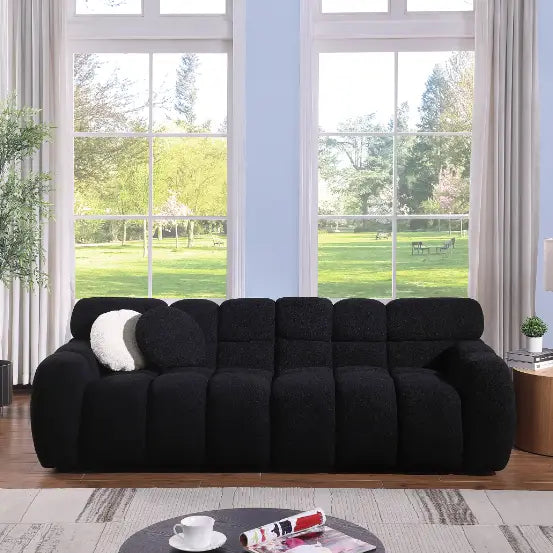 Elegant black boucle sofa for timeless designer living spaces