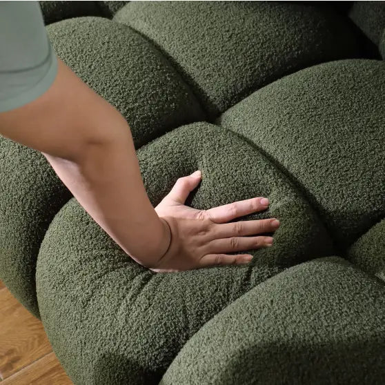 Elegant green boucle sofa for luxury fashion in living spaces