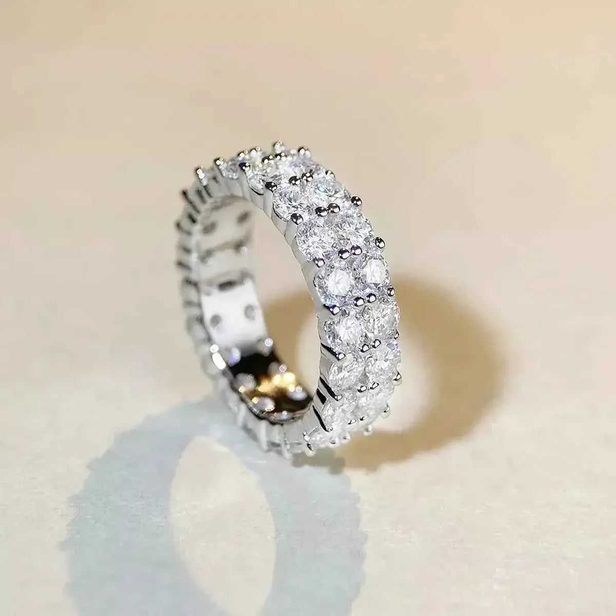 925 Sterling Silver Moissanite Ring with a continuous row of round clear moissanite stones set in polished silver band