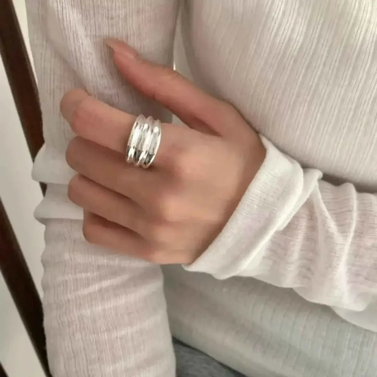 925 Sterling Silver open ring featuring a polished, layered band design worn on a hand with a white long sleeve top