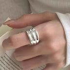 925 Sterling Silver open ring with a shiny, polished finish worn on a finger showing its smooth rounded edges