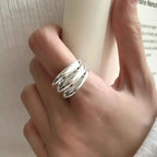 925 Sterling Silver open ring with a polished triple band design on a hand