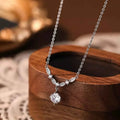 925 Sterling Silver pendant necklace with delicate chain, small clear zircon stones, and a larger dangling zircon centerpiece