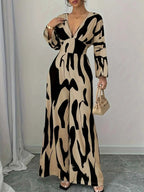 Abstract Print V-Neck wide leg jumpsuit in beige and black with a belted waist and long sleeves