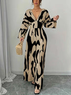 Abstract Print V-Neck wide leg jumpsuit in beige and black with long sleeves and belted waist detail