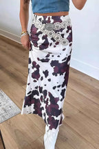 Abstract Print Western long skirt in white and dark purple polyester with black abstract splash pattern, metal zip-up waist, worn with a white belt and white shoes