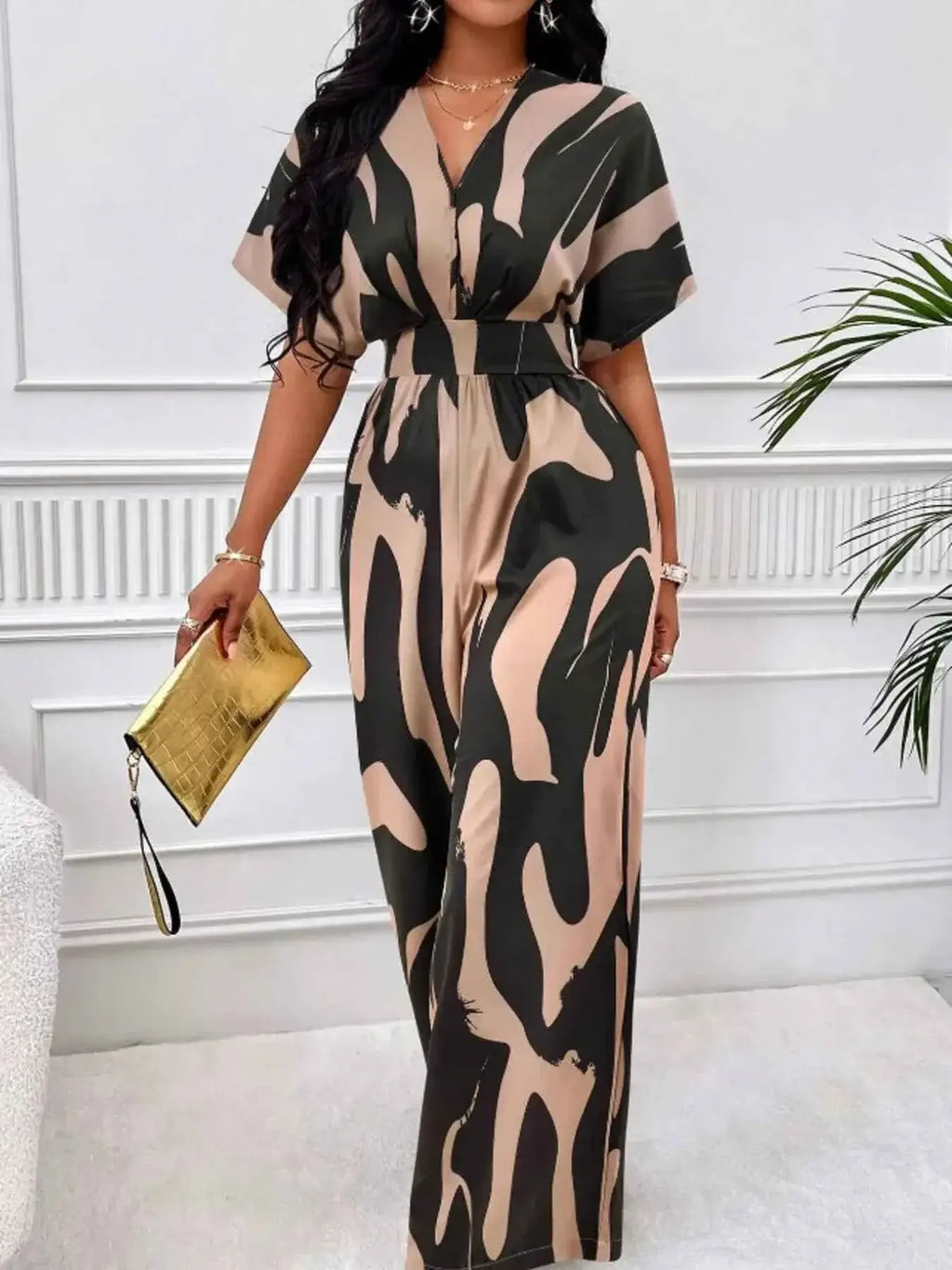 Abstract Print Wide-Leg Jumpsuit with ruched beige and black abstract patterns, a V-neck, and short sleeves made from polyester